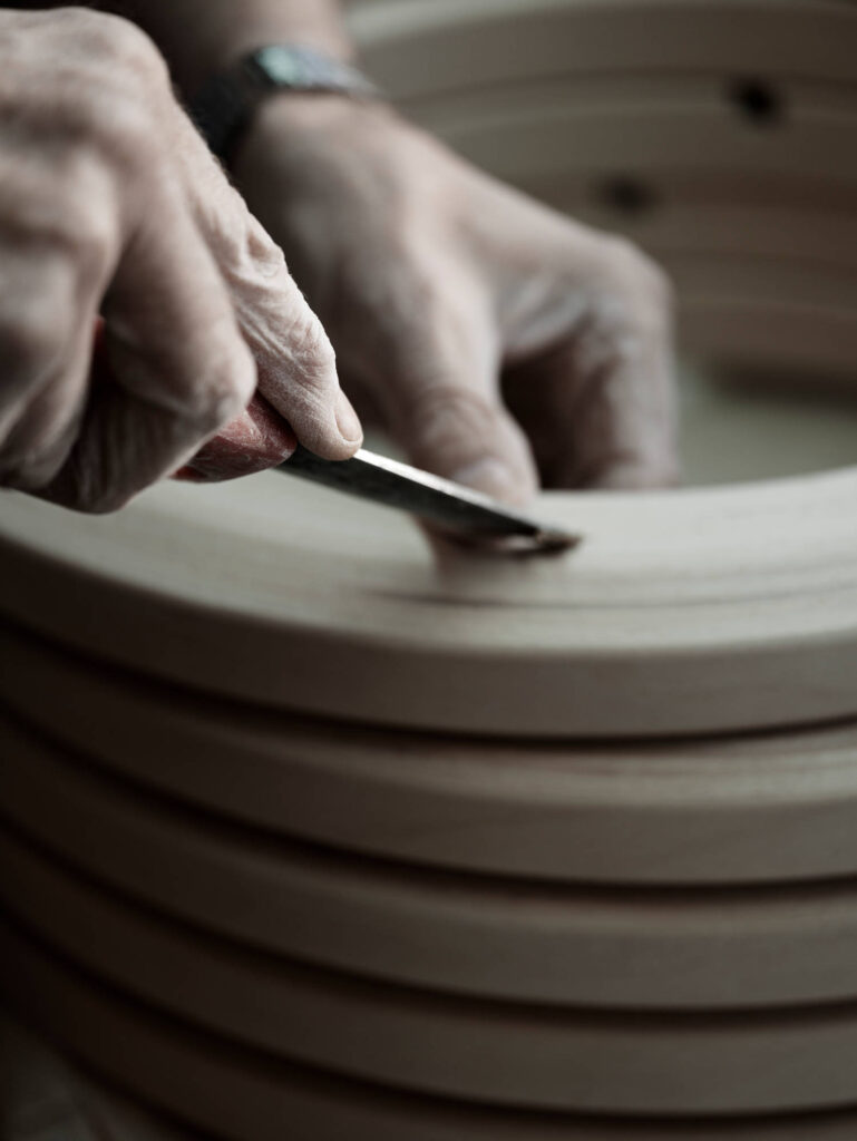 Craftsman repairing wooden base